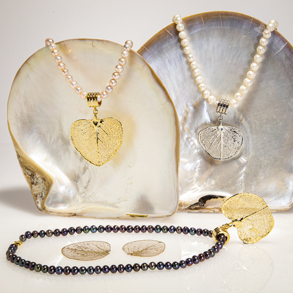 Eucalyptus Apple Gum Leaf hanging on a lustrous Pearl Necklace
