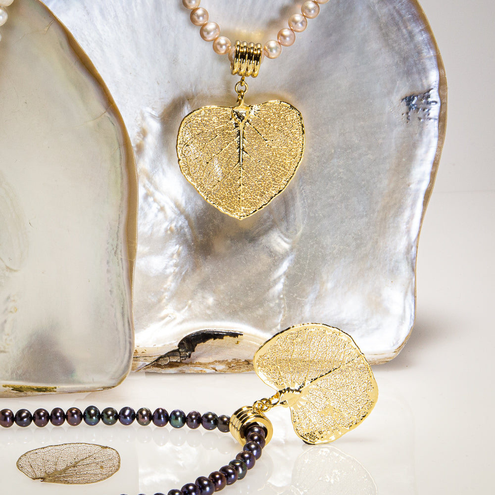 Eucalyptus Apple Gum Leaf hanging on a lustrous Pearl Necklace