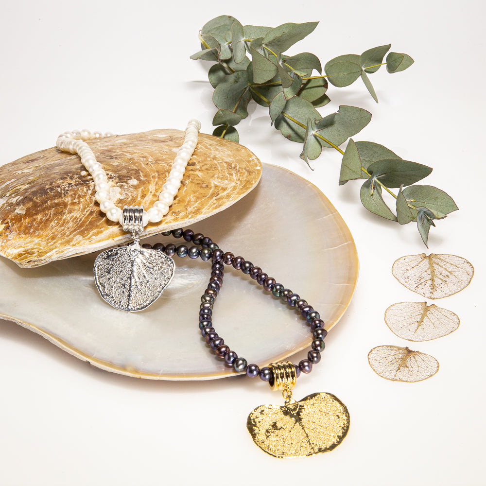 Eucalyptus Apple Gum Leaf hanging on a lustrous Pearl Necklace